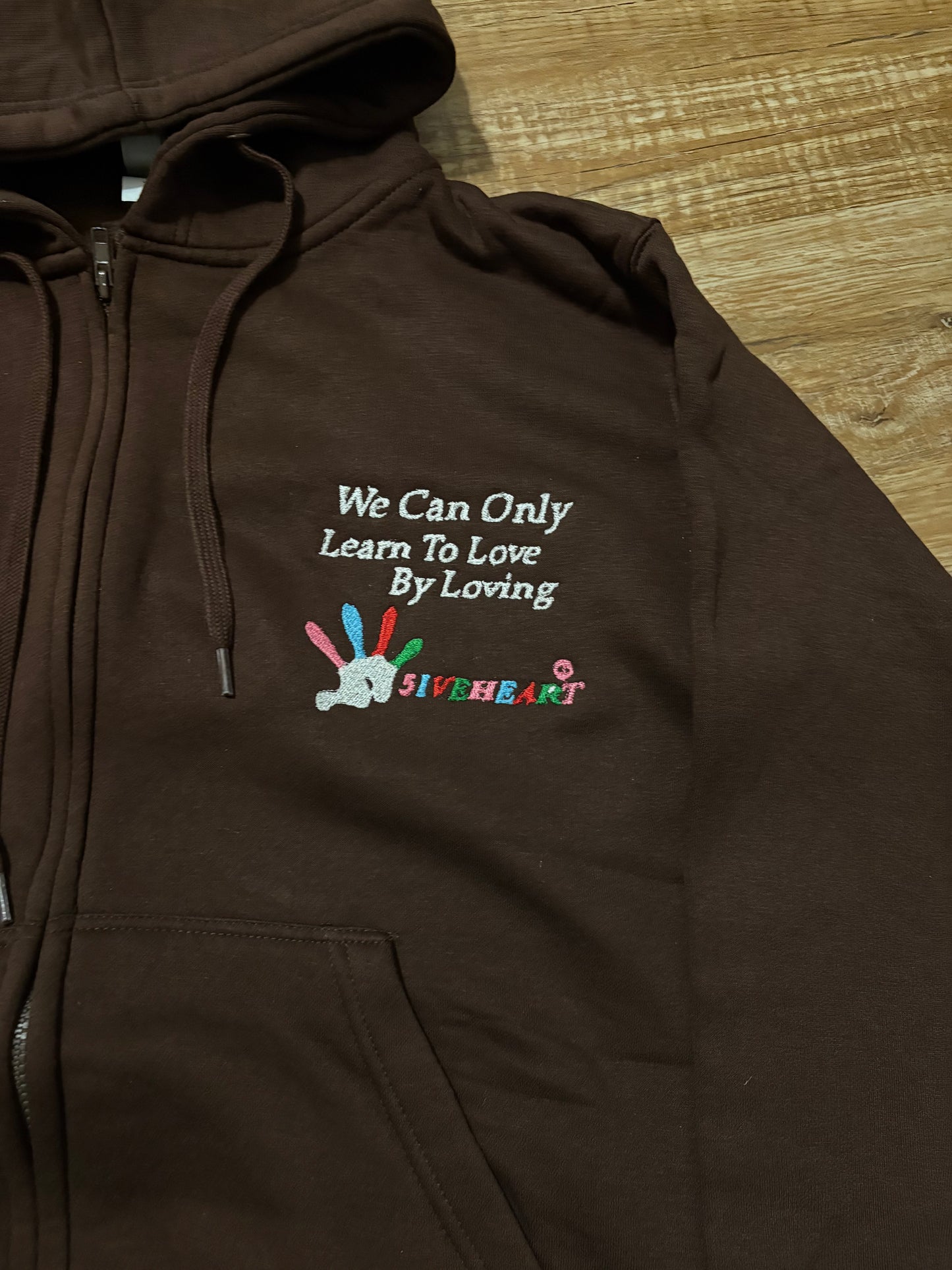 We can only learn to love by loving zip up hoodie